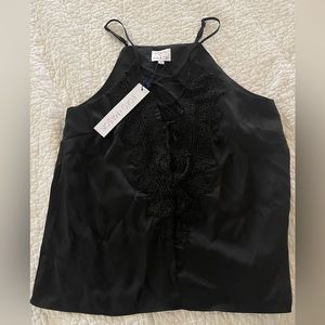 Black camisole with cutouts and lace intricate detailing. From Vici dolls drop